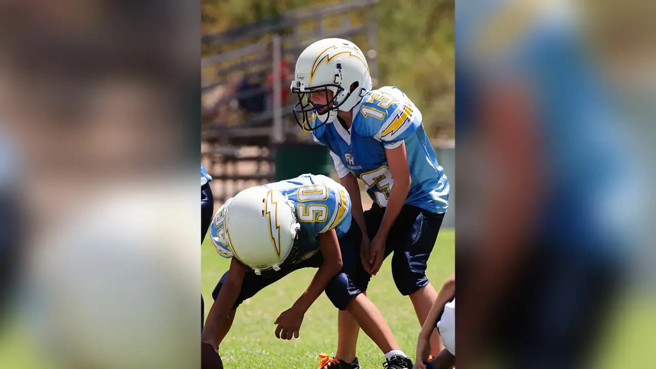 Youth football players in action.