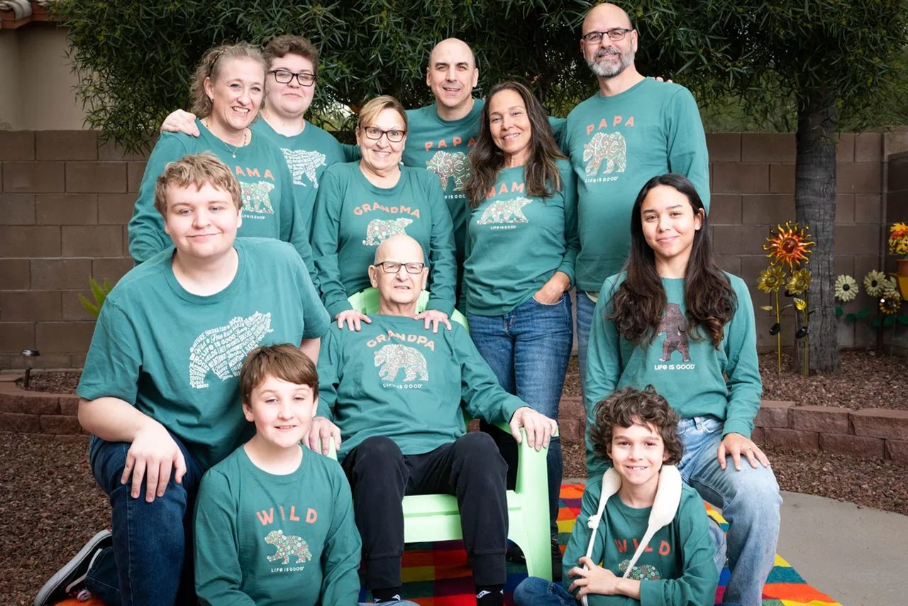 Multigenerational family in matching shirts.